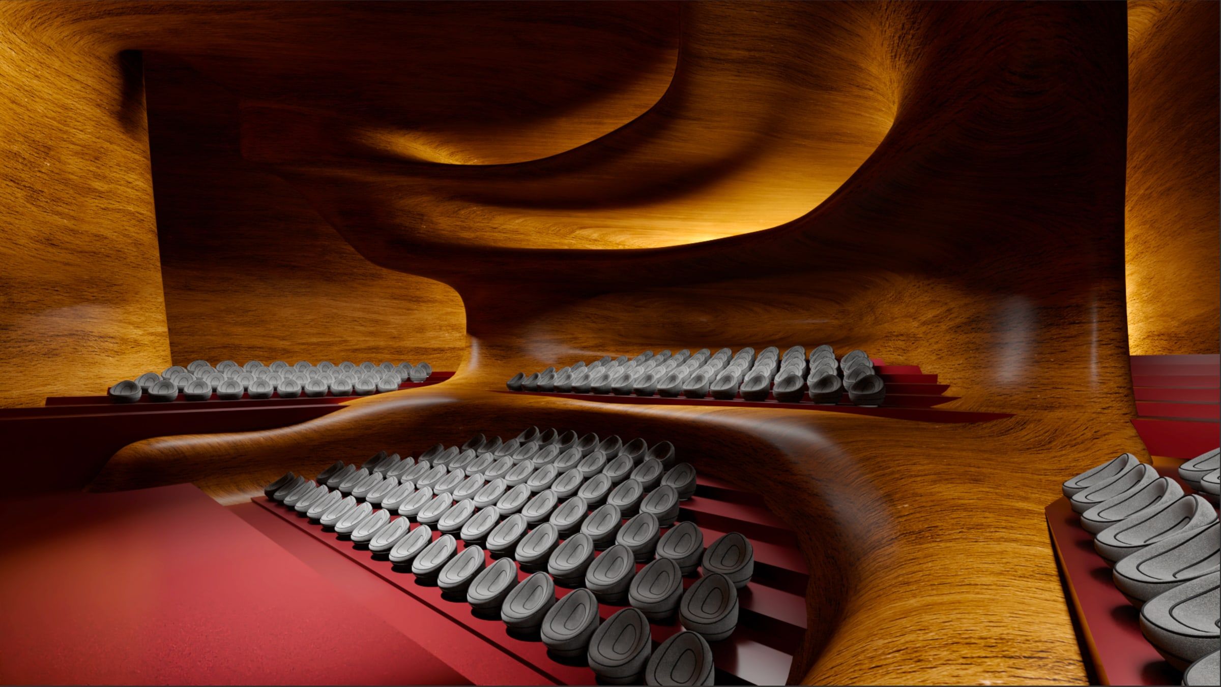 Vue intérieure de l’auditorium : parois organiques en bois, gradins rouges