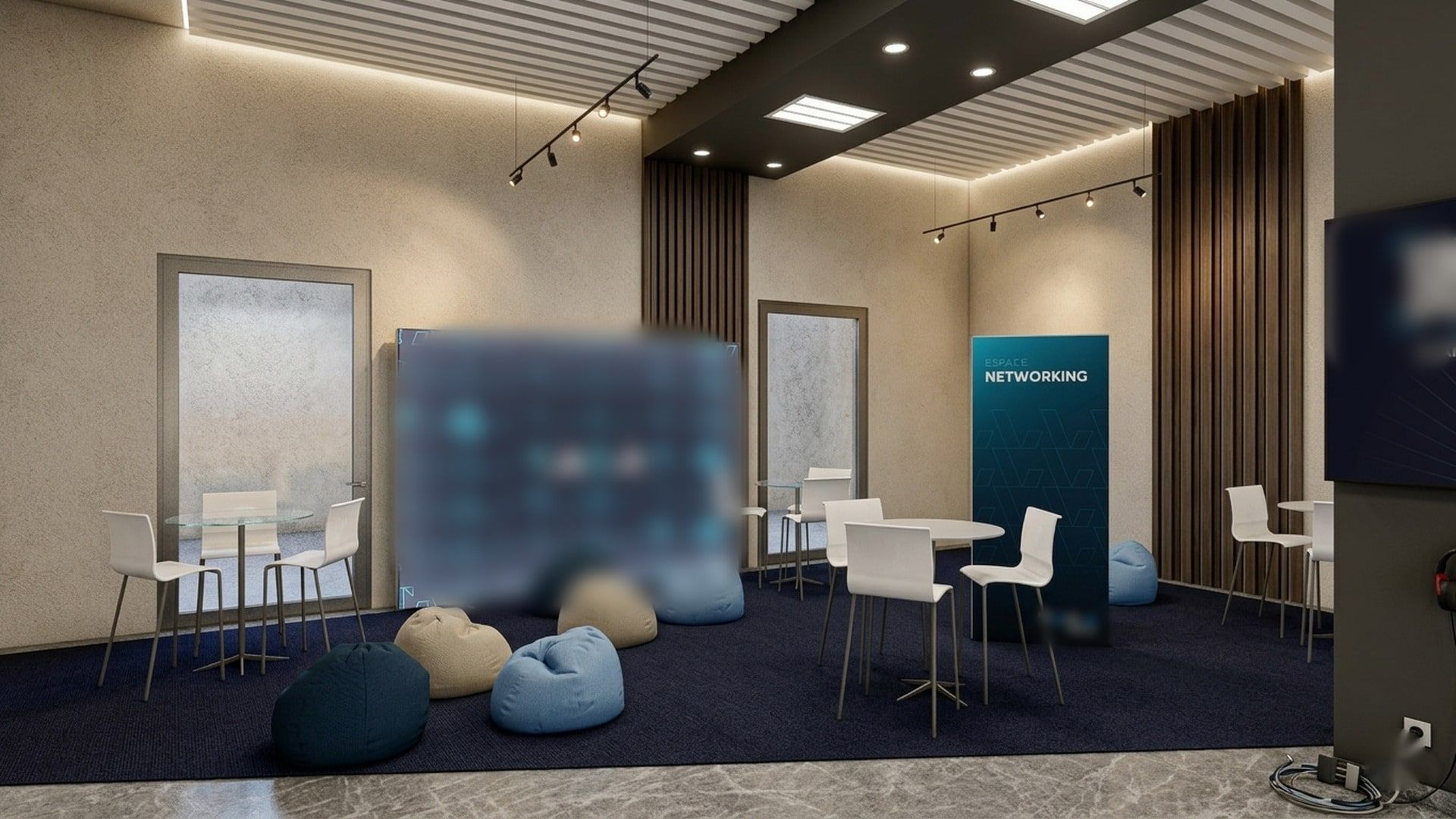 Vue 3D de l’espace networking : tables hautes, poufs et mur rétroéclairé
